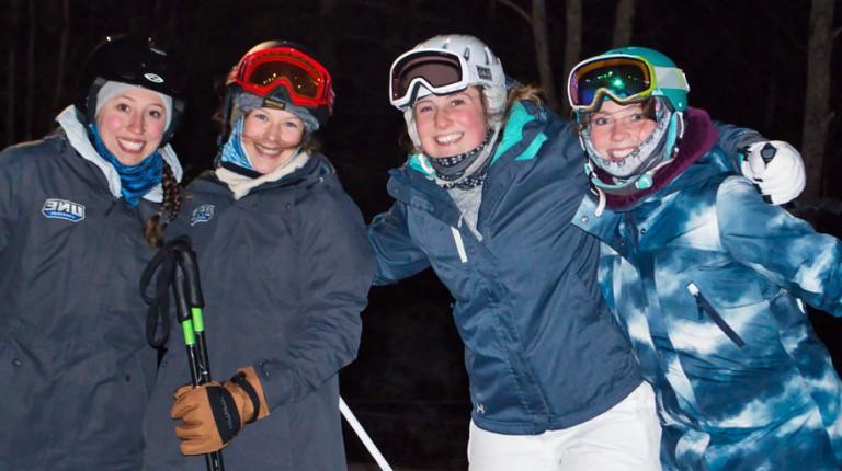 Four U N E students on a ski trip